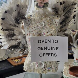 Handmade ceramic torso sculpture with feathered angel wings and mosaic detailing, displayed at Coolum Hearts.